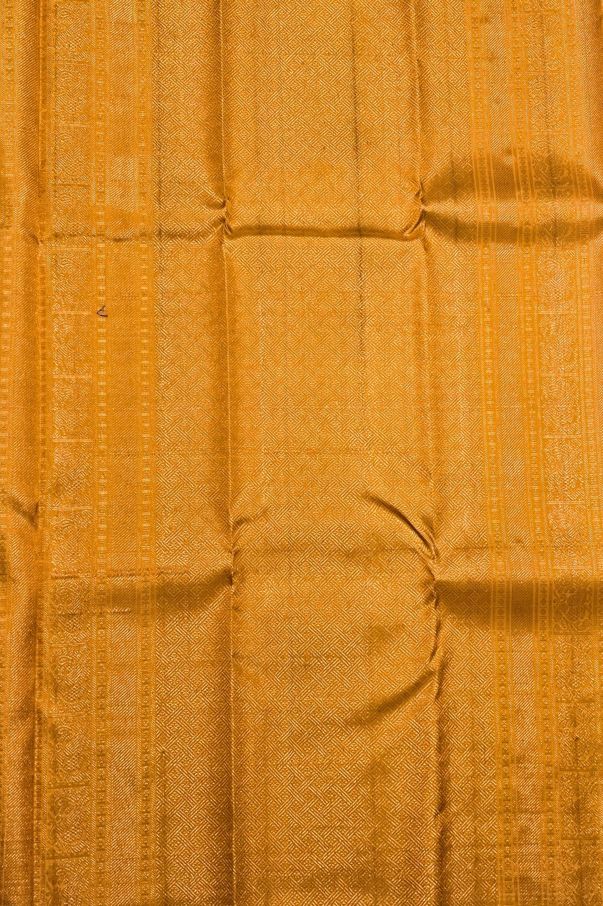 Close-up of textured orange fabric with visible folds