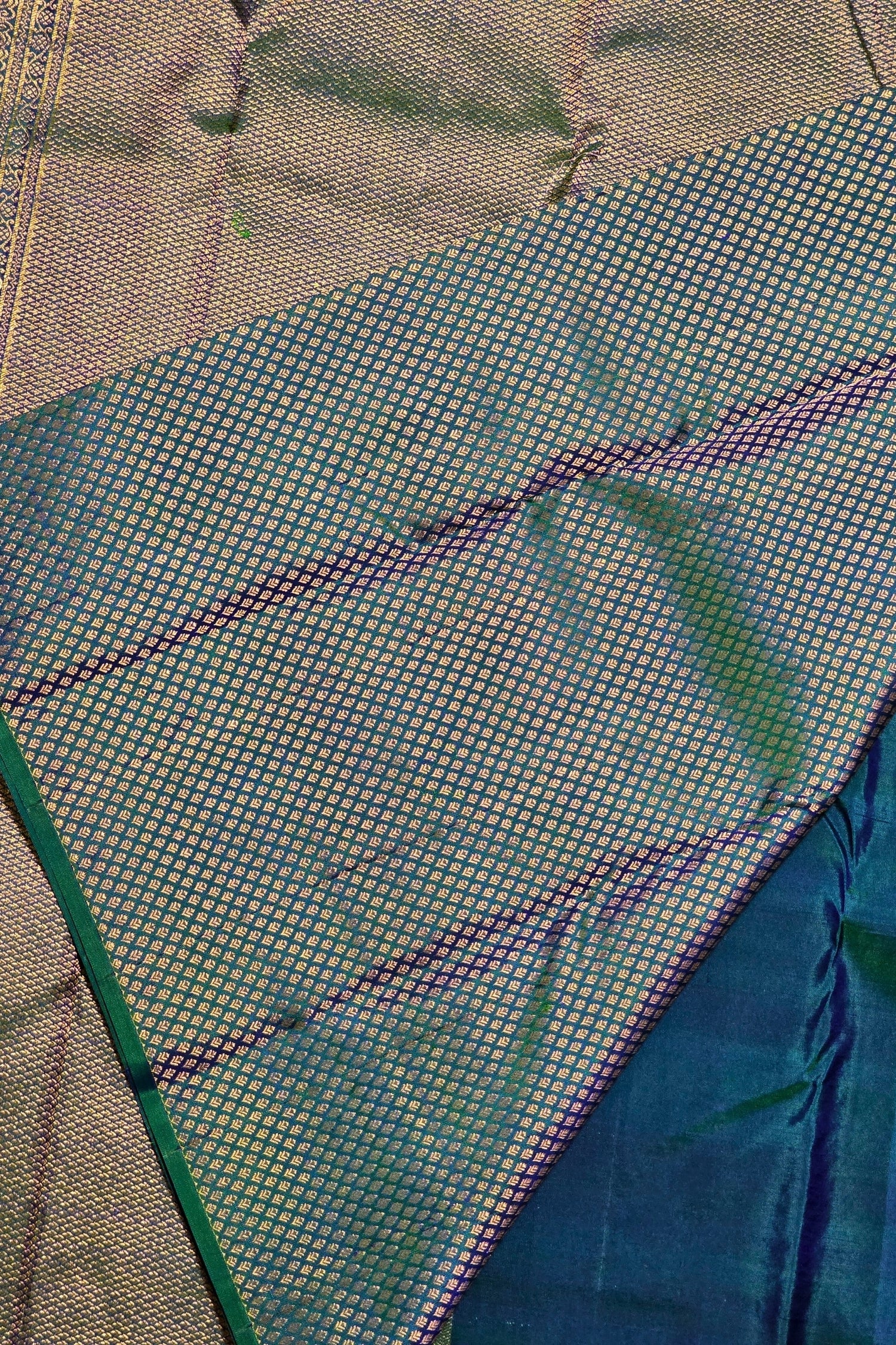 Close-up of a textured fabric with blue and green patterns