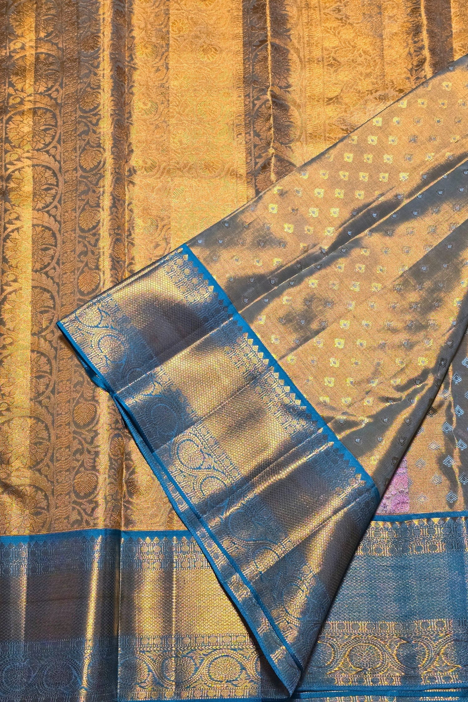 Close-up of a gold and blue patterned fabric