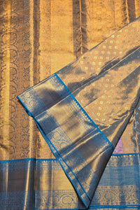 Close-up of a gold and blue patterned fabric