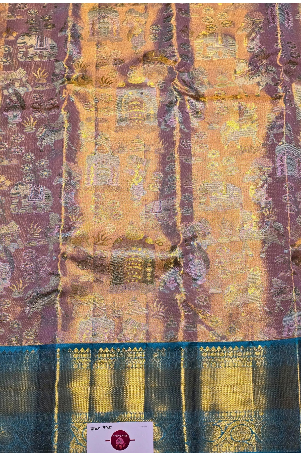 Traditional fabric with intricate patterns and a visible brand label.