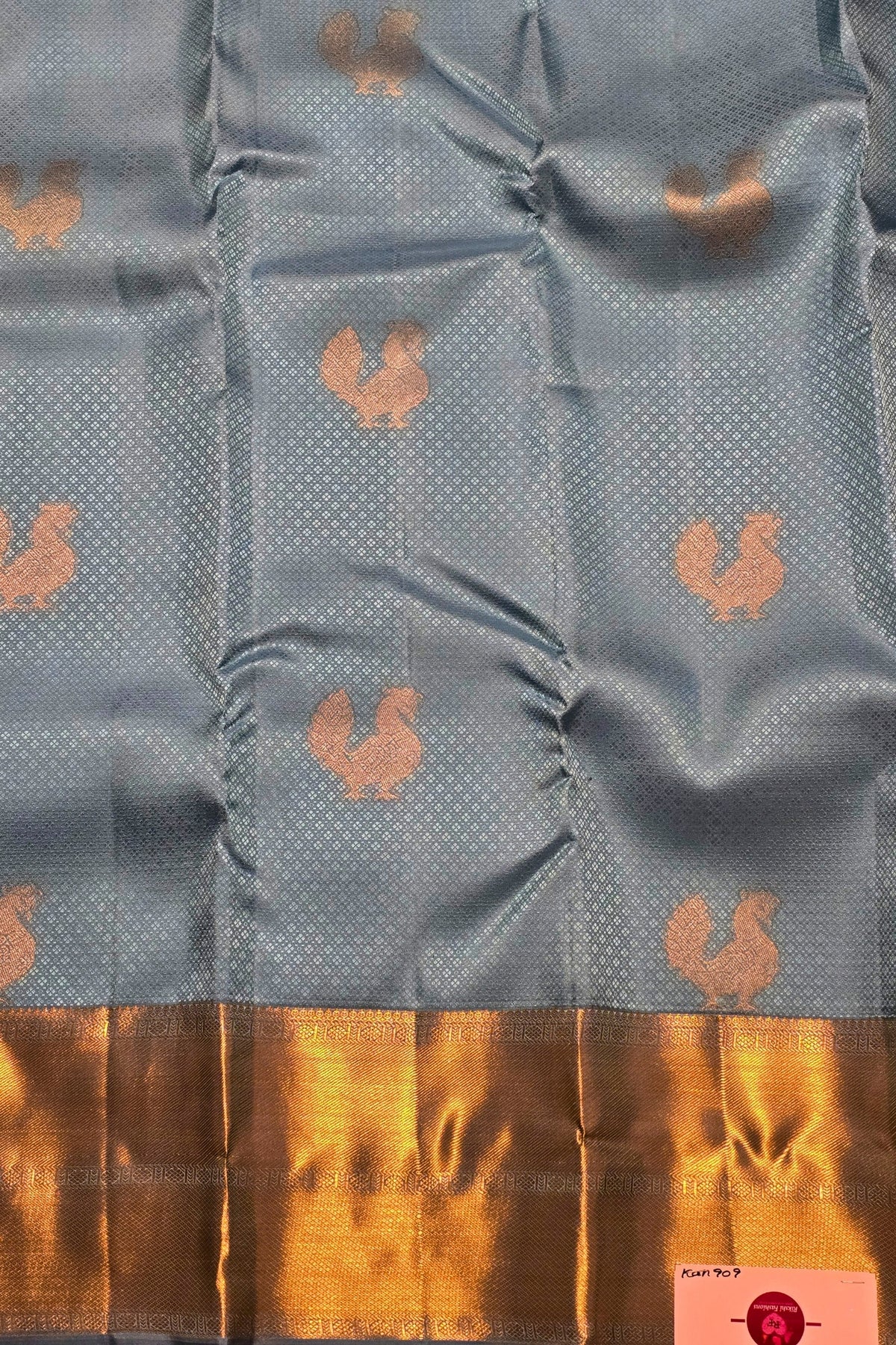 Gray fabric with gold patterns and border