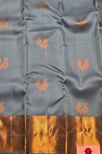 Gray fabric with gold patterns and border