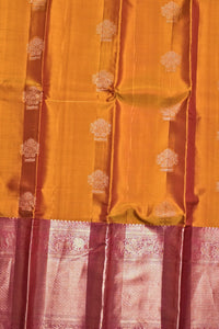Traditional saree with a yellow and pink patterned border