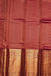 Maroon saree with gold border and patterns