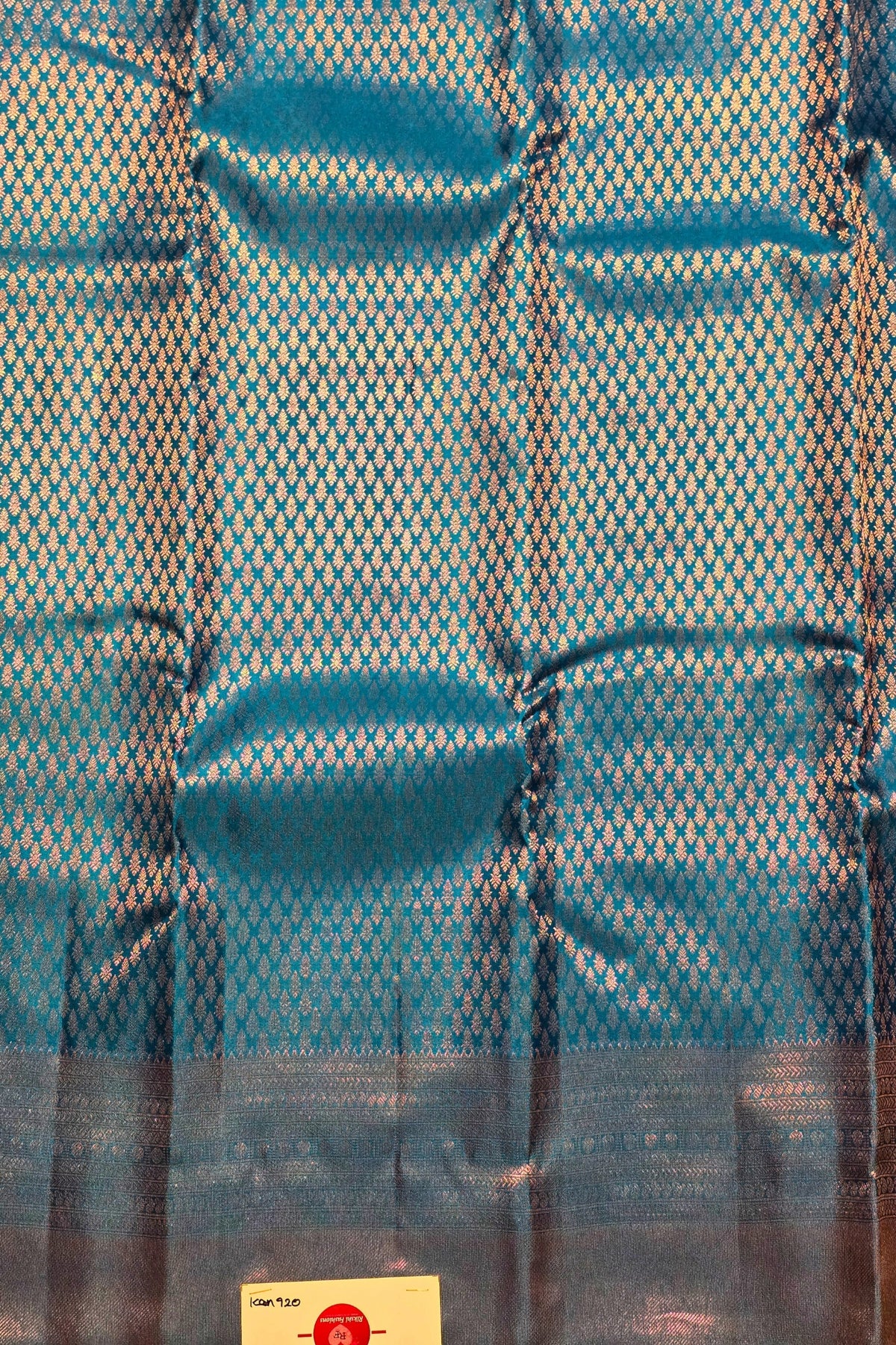 Blue fabric with a subtle pattern on a plain background