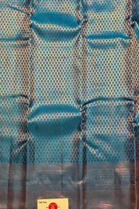 Blue fabric with a subtle pattern on a plain background