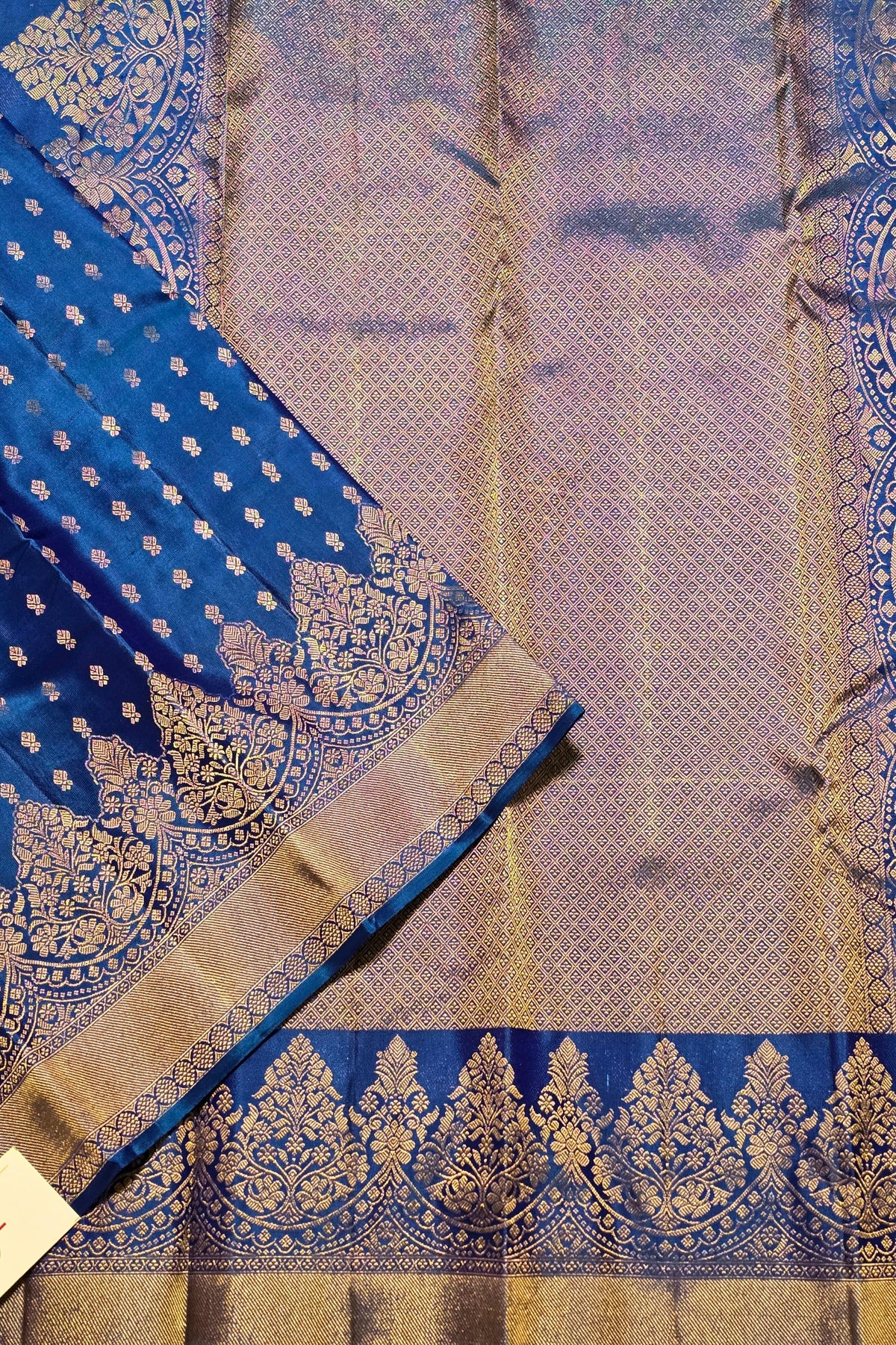 Blue and gold traditional fabric with intricate patterns