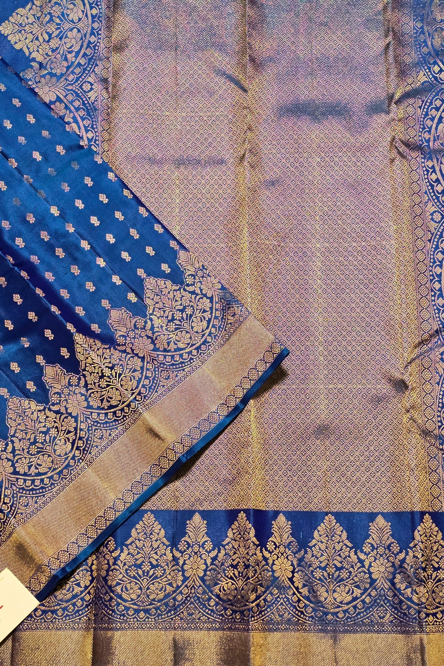 Blue and gold traditional fabric with intricate patterns