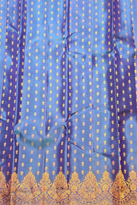 Blue fabric with gold patterns and embroidery