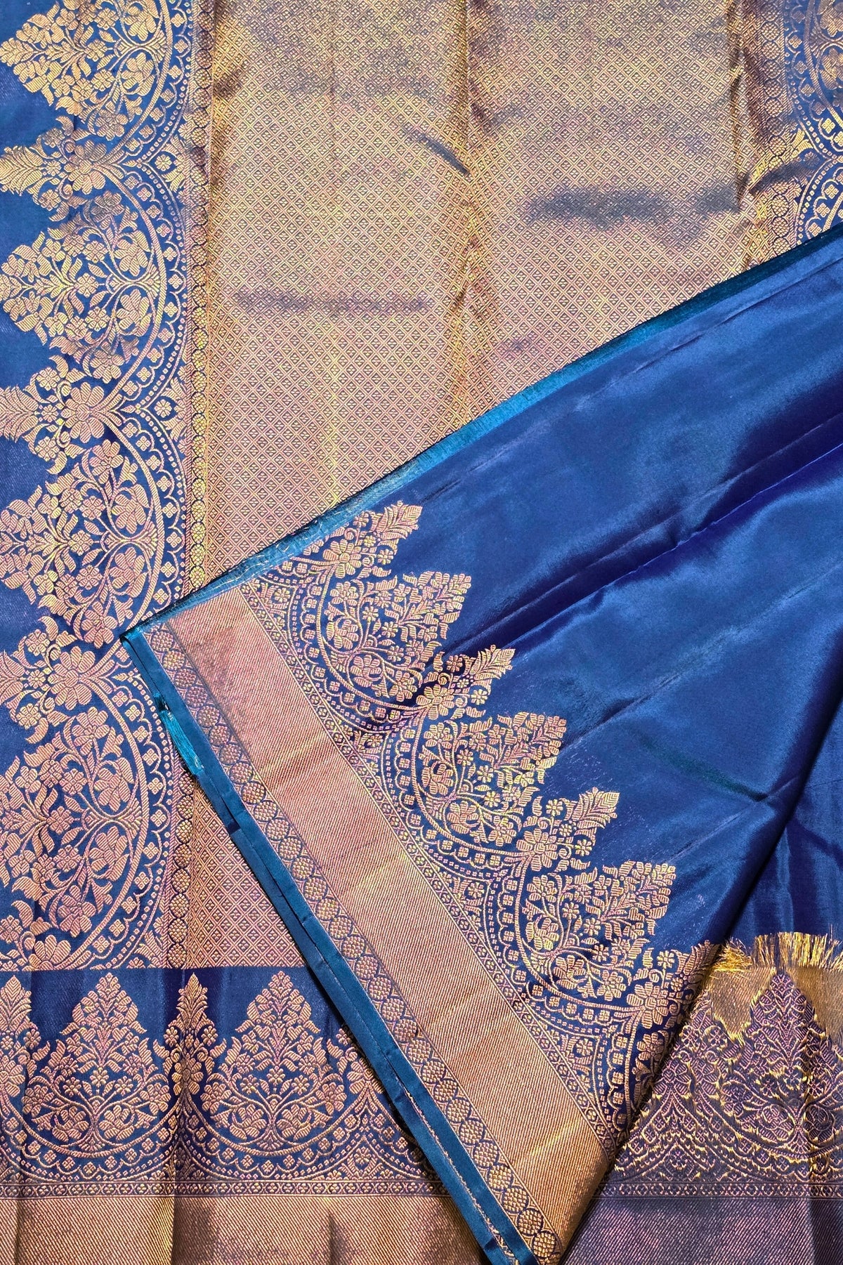 Blue and gold traditional fabric with intricate patterns