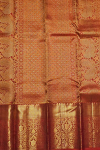 Close-up of a patterned fabric with intricate designs in shades of brown.