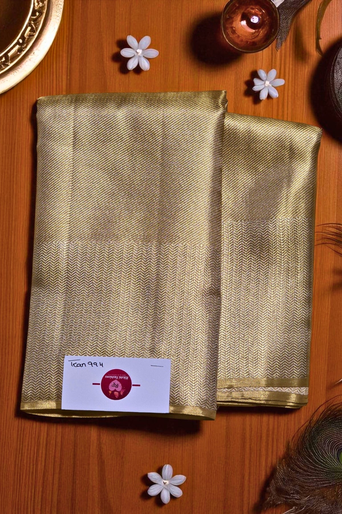 Gold fabric with a label on a wooden surface
