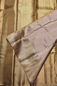 Close-up of gold fabric with a textured pattern
