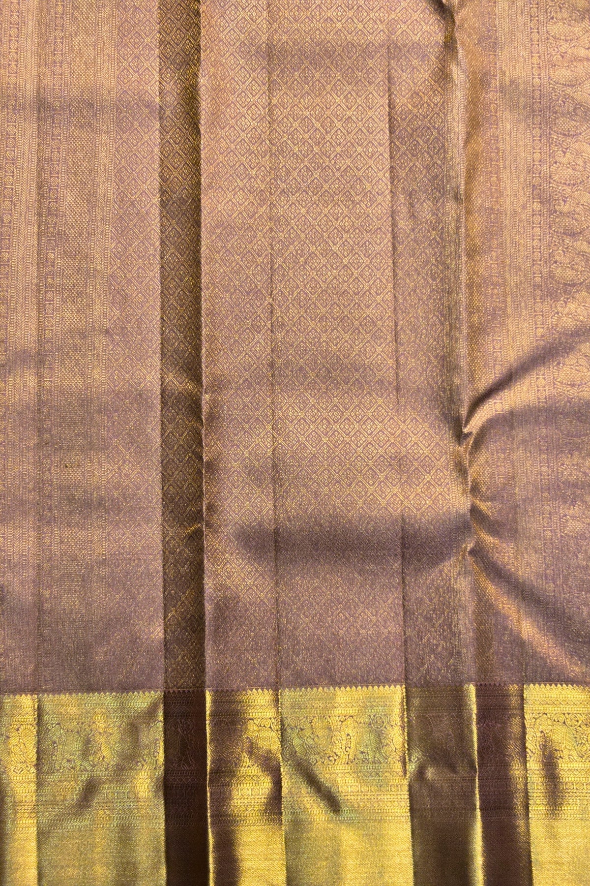 Close-up of a fabric with brown and green checkered pattern