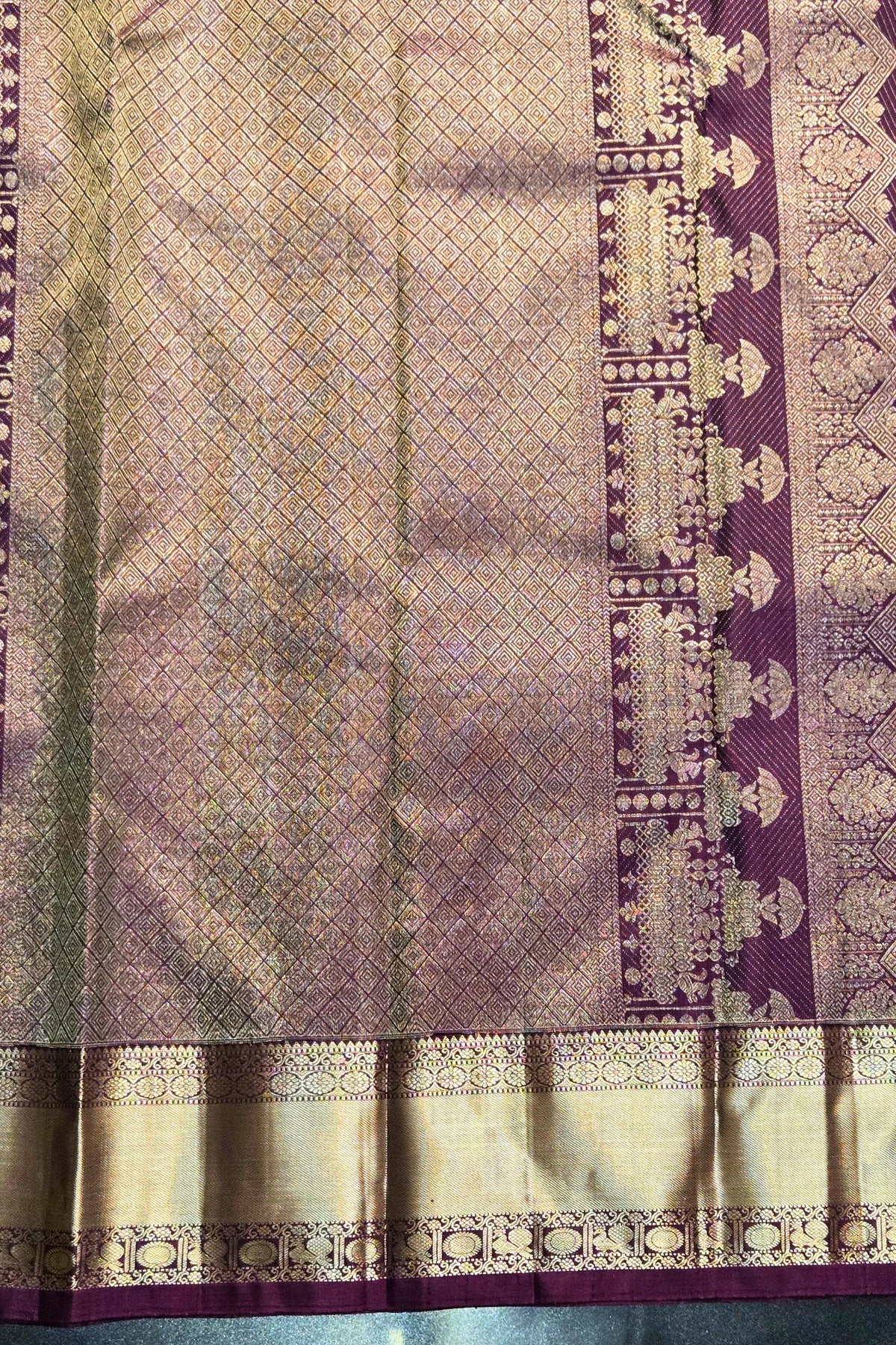 Traditional saree with intricate patterns and a border