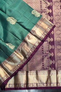 Green and purple saree with intricate patterns