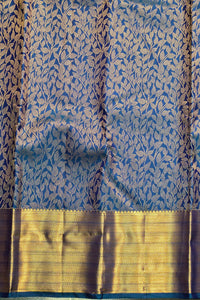 Blue and gold traditional fabric with leaf pattern