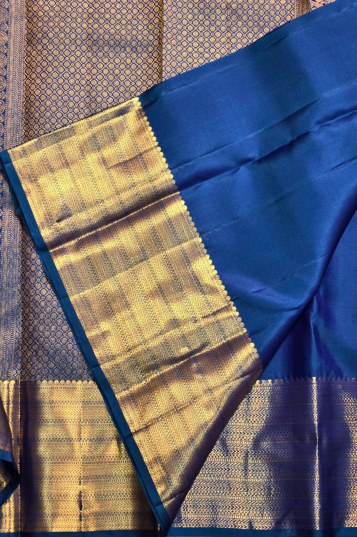 Blue and gold traditional fabric with a checkered pattern