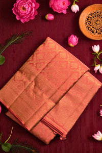 Folded fabric on a red surface with pink flowers and a decorative bowl.