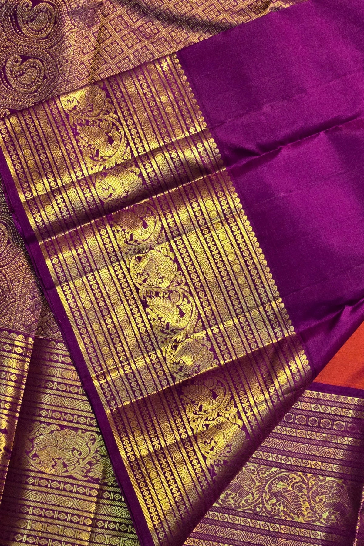 Purple saree with gold zari work and elephant patterns