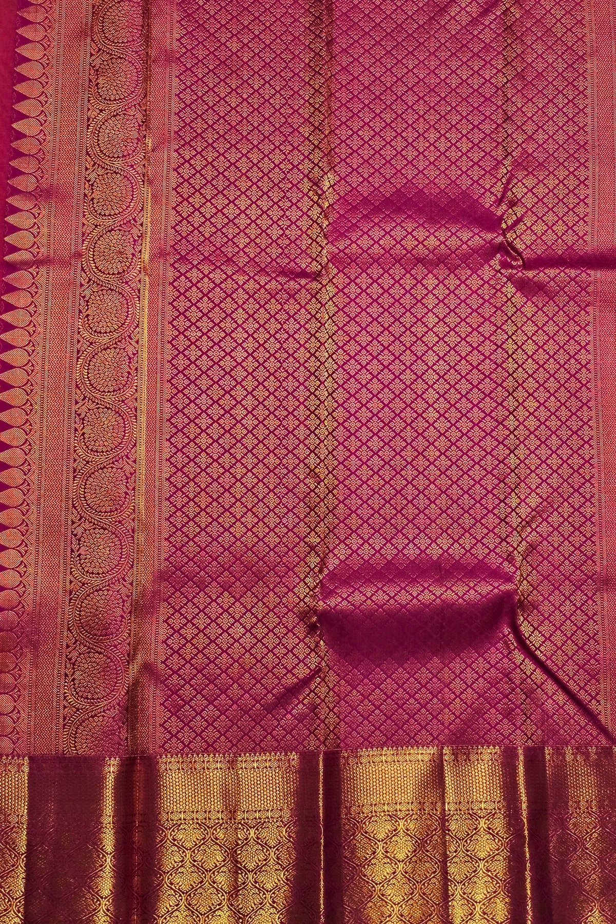 Pink saree with gold zari patterns