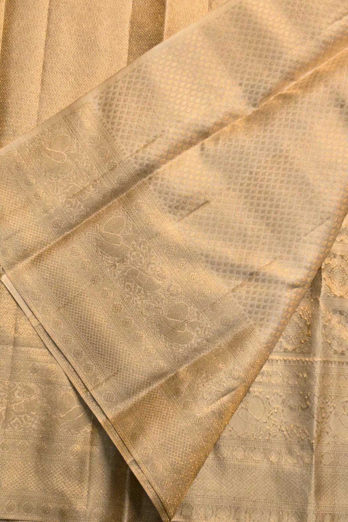 Close-up of a textured beige fabric with a diamond pattern