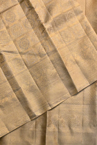 Close-up of a textured beige fabric with a subtle pattern