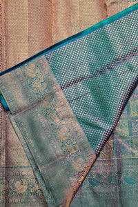 Close-up of a patterned fabric with teal and gold colors