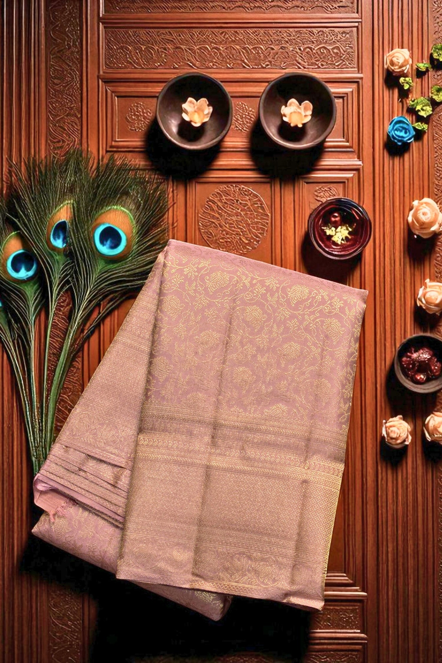 Folded saree on a wooden surface with decorative elements