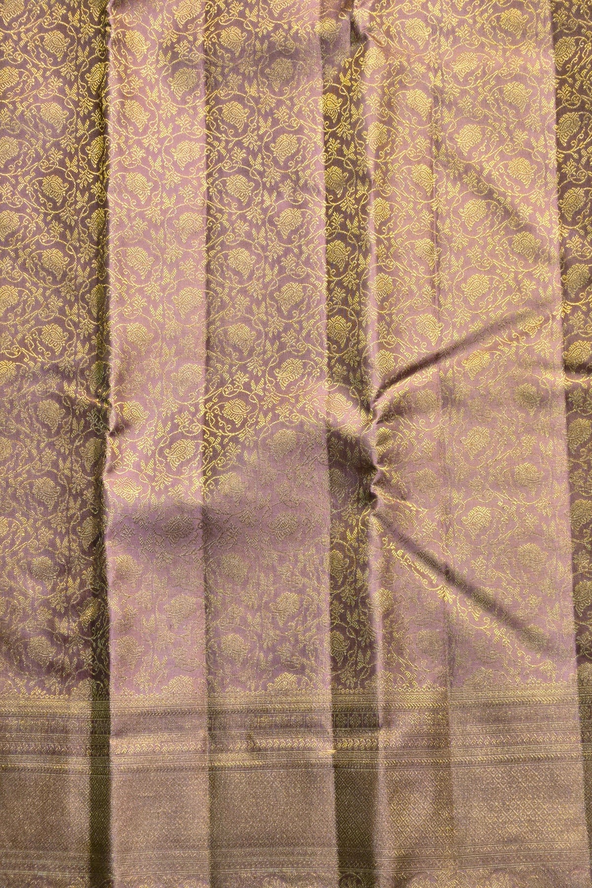 Patterned fabric with a mix of green and purple tones