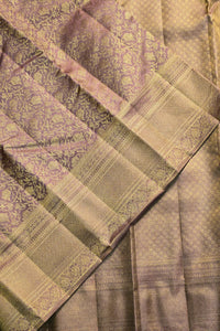 Close-up of a patterned fabric with green and purple tones