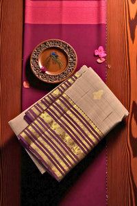 Traditional fabric with gold patterns on a wooden surface