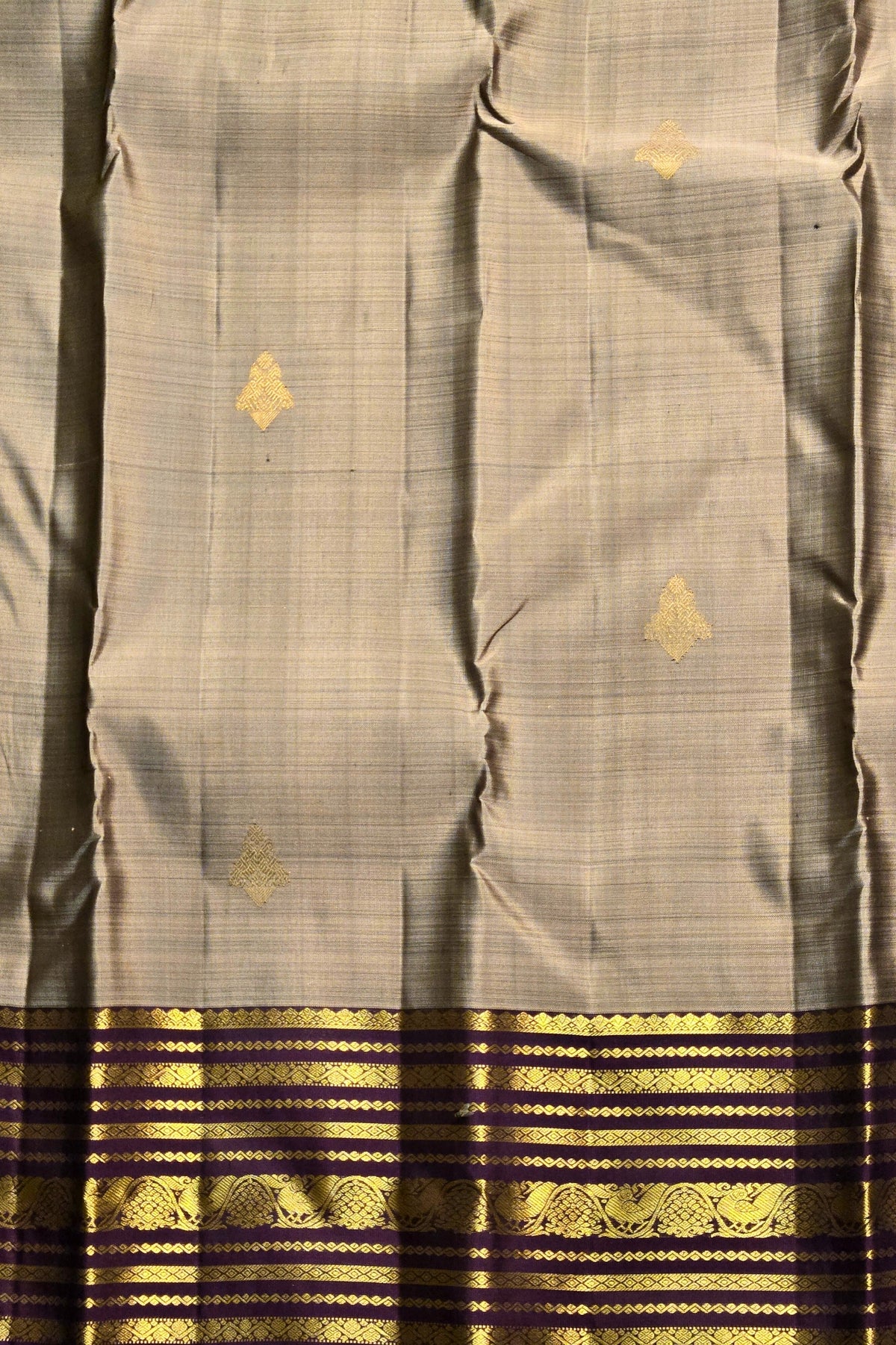 Gray saree with gold and black border