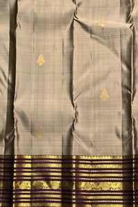 Gray saree with gold and black border
