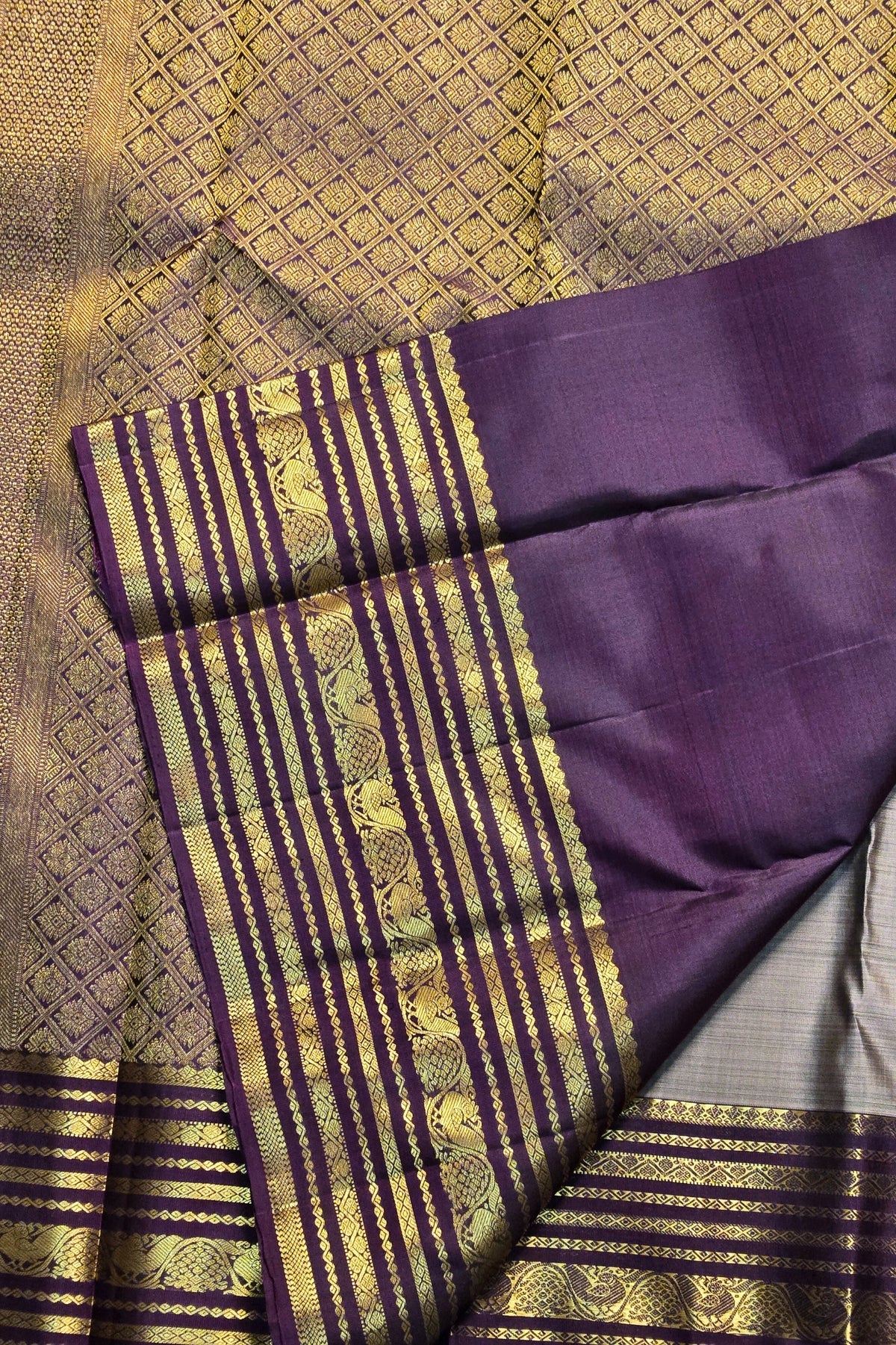Purple and gold traditional fabric with intricate patterns