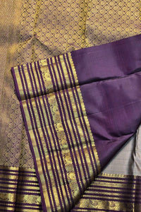 Purple and gold traditional fabric with intricate patterns