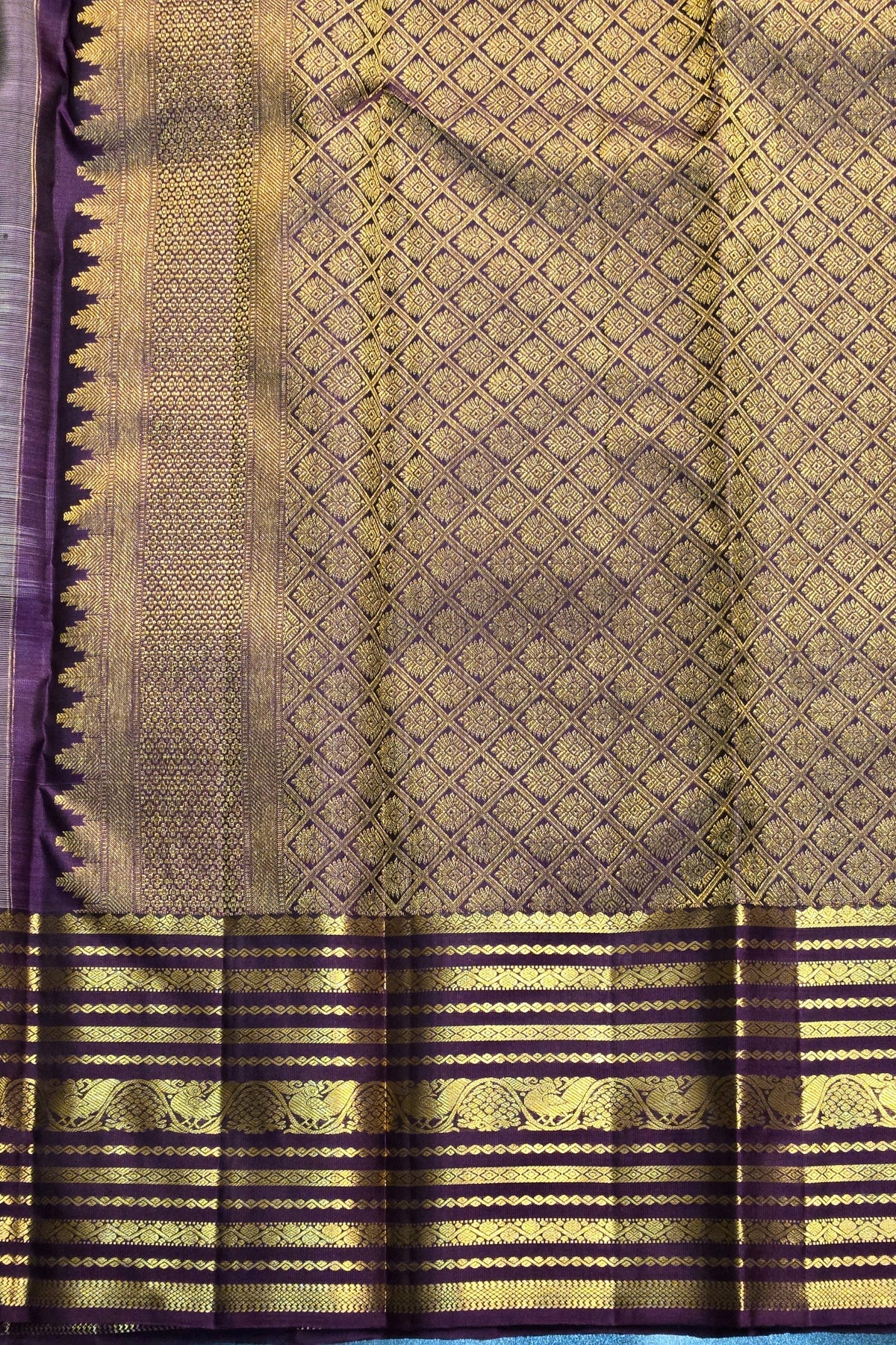 Traditional saree with a purple and gold pattern