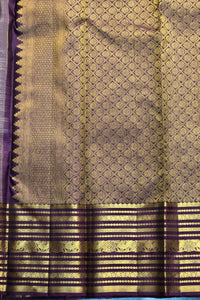 Traditional saree with a purple and gold pattern