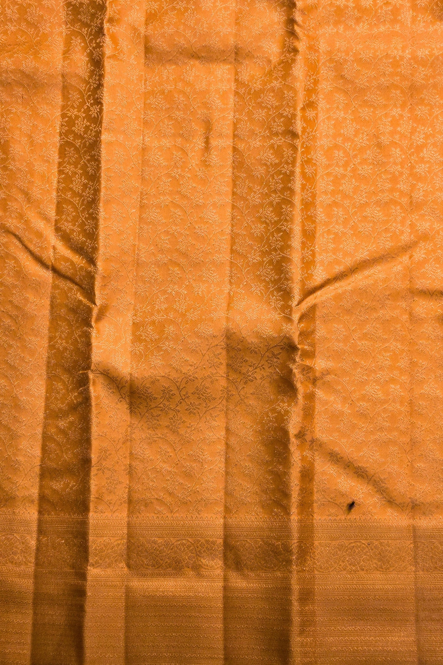 Close-up of orange fabric with visible texture