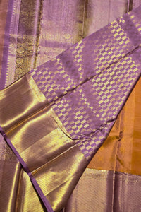 Close-up of a purple and gold fabric with intricate patterns