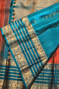 Blue saree with gold patterns on a red background