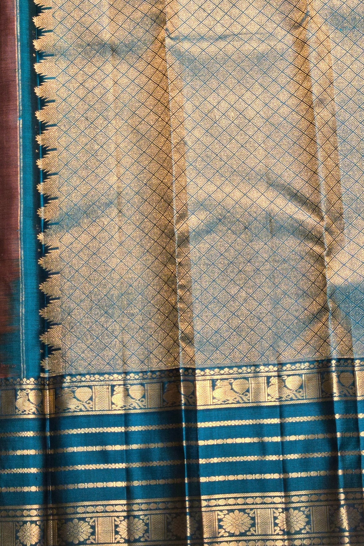 Blue and gold patterned fabric with intricate designs