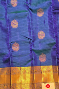 Blue and purple fabric with gold border and patterns