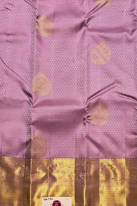 Purple fabric with gold circular patterns