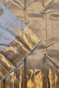 Close-up of a textured fabric with gold and brown patterns