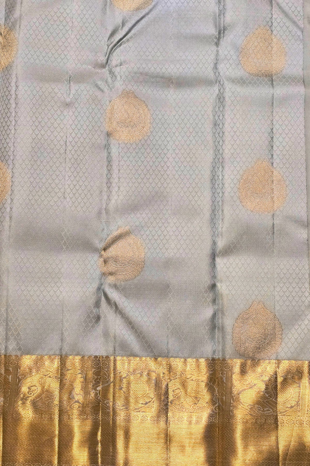 Gray fabric with gold leaf patterns