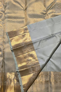 Close-up of a fabric with gold and gray patterns