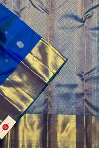 Blue and gold saree with a visible brand label