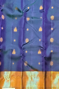 Blue fabric with gold patterns and a yellow border